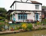 canal side cottage with 'lock gates' in the garden