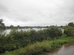 flooded fields flow across the towpath