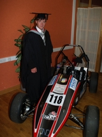 Matt, alongside the car they built, at the graduation.